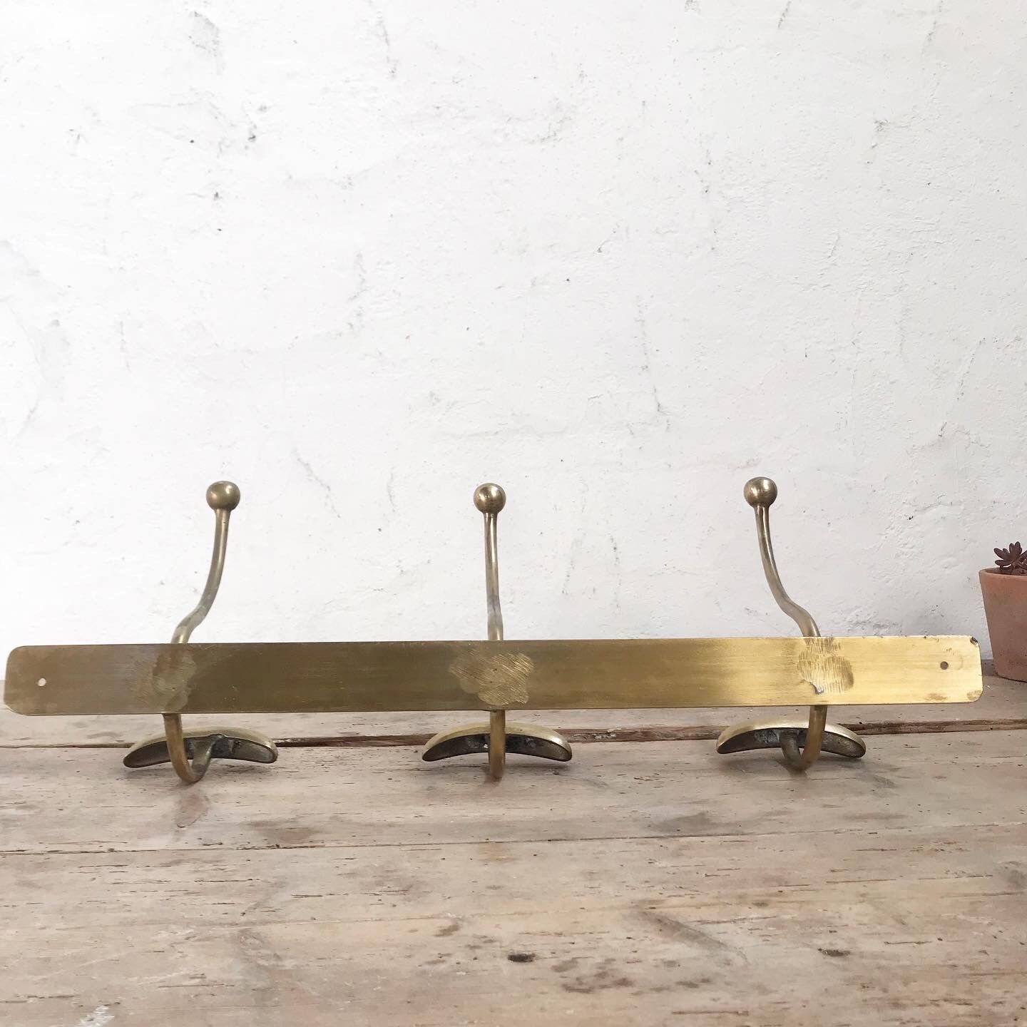 Brass wall coat rack