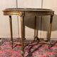 Table guéridon style Louis XVI en bois doré