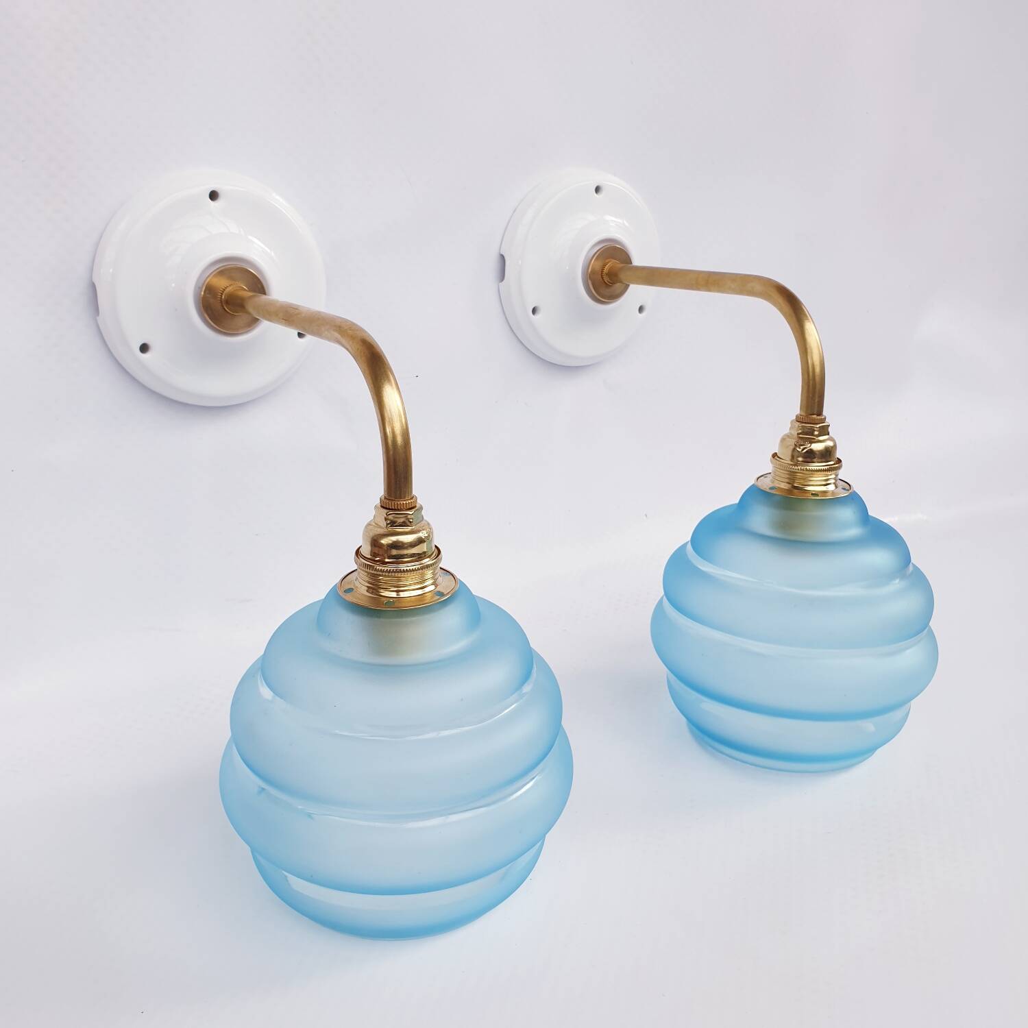 Vintage brass and blue glass wall lights