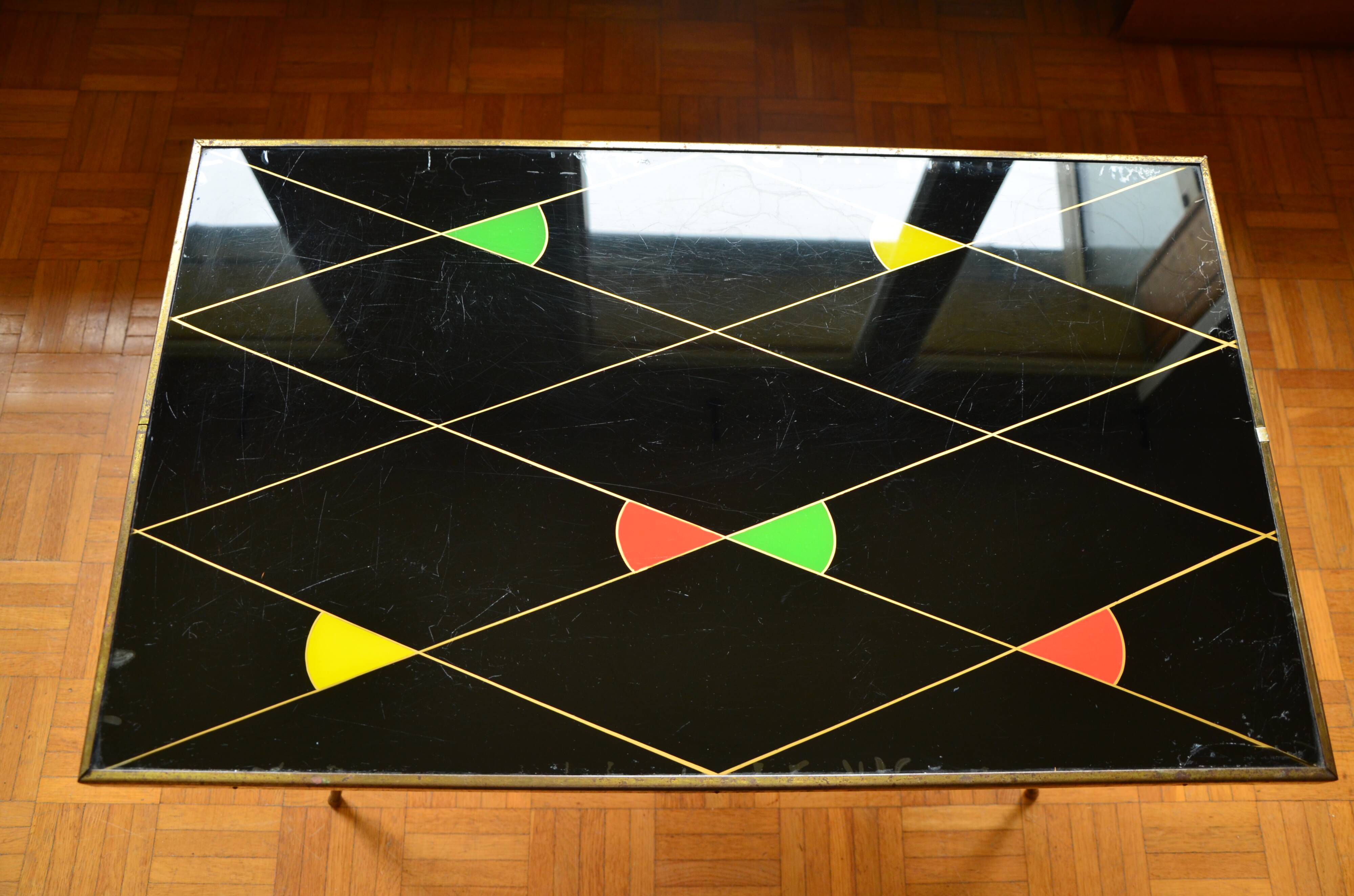 Brass and glass coffee table with compass feet