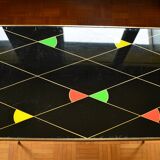 Brass and glass coffee table with compass feet