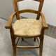 Wooden children's high chair and mulched seat