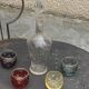 Liqueur carafe, or aperitif, carved with floral decoration in transparent glass and 4 polka dot glasses
