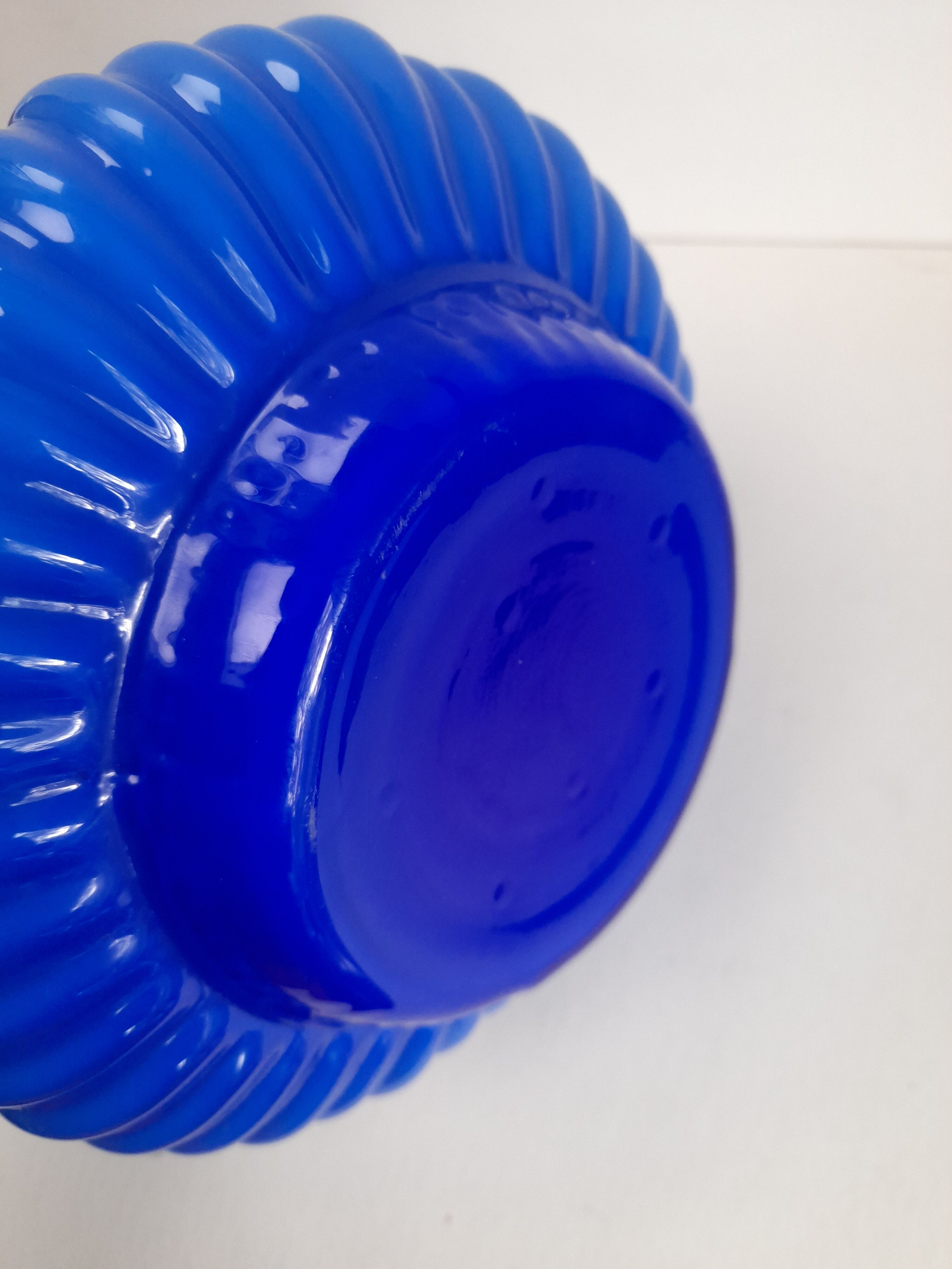 Blue opaline vase with a round handle
