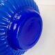 Blue opaline vase with a round handle