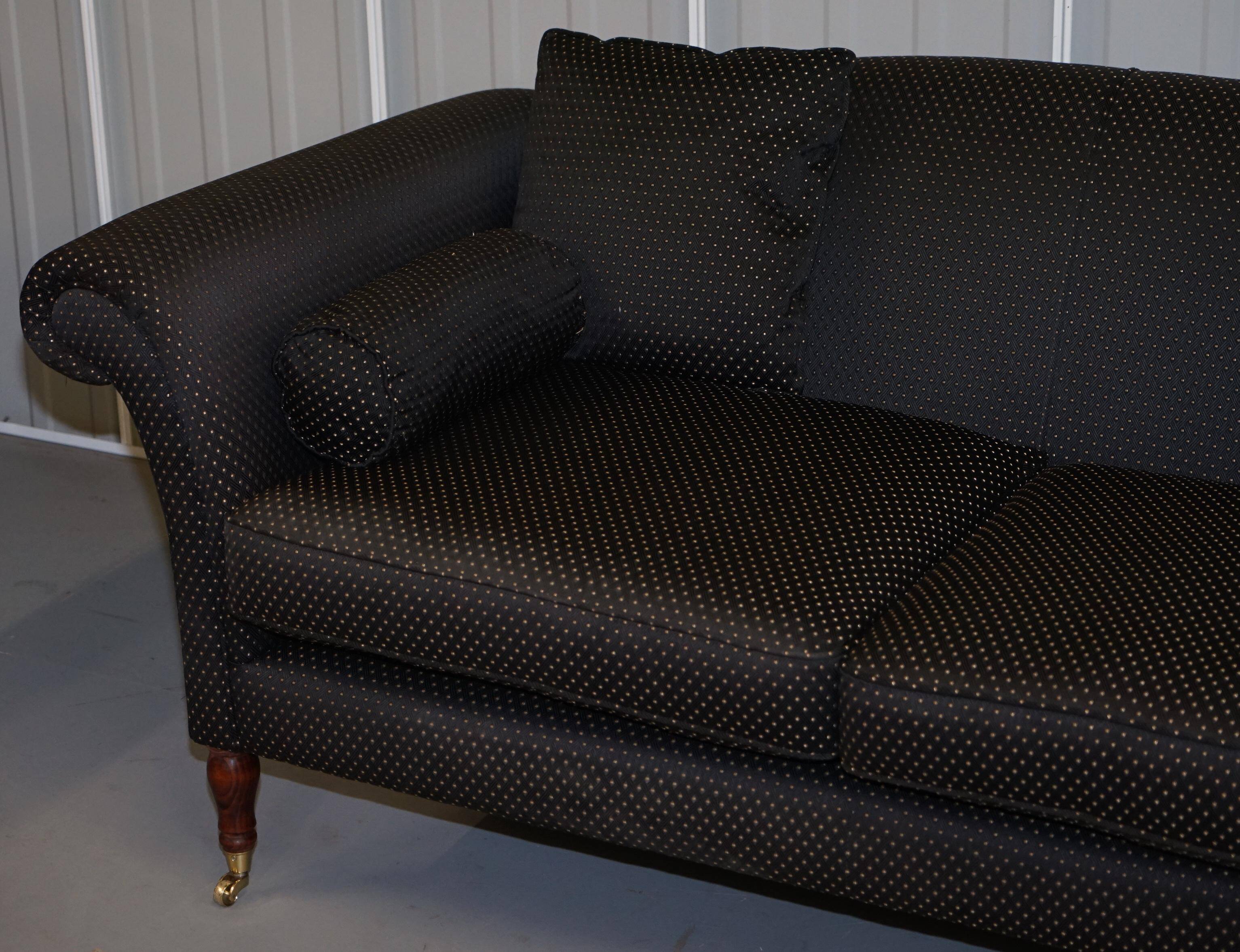 Three-seater Art Deco canapé with a light hardwood frame.