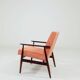 Mid-century modern armchair in coral red designed by H. Lis.