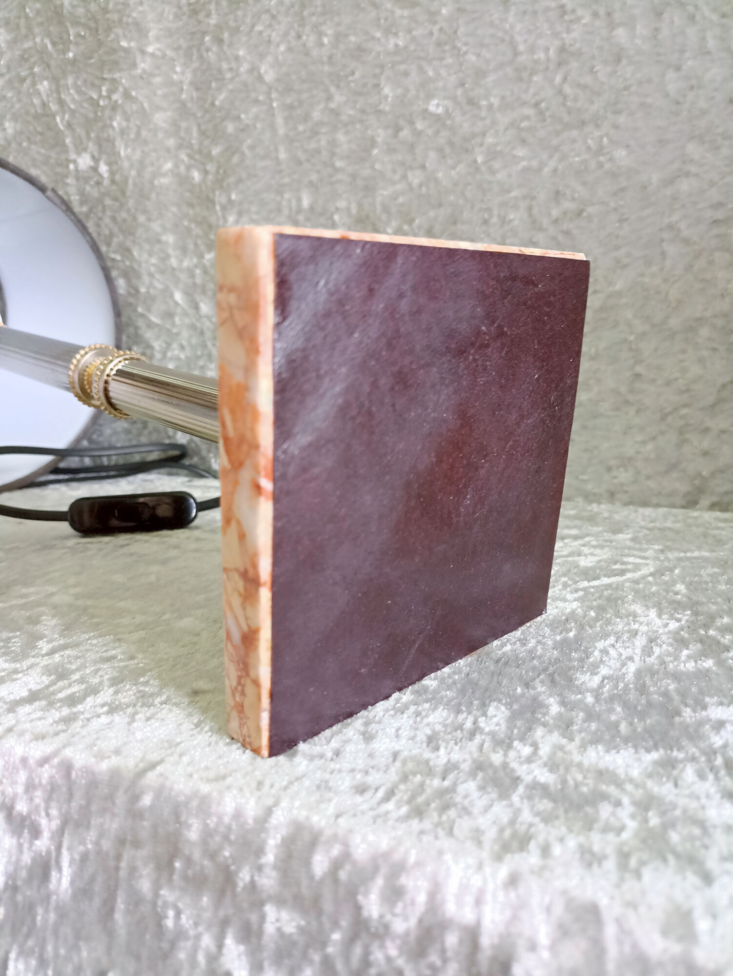 Golden metal lamp with pink marble base