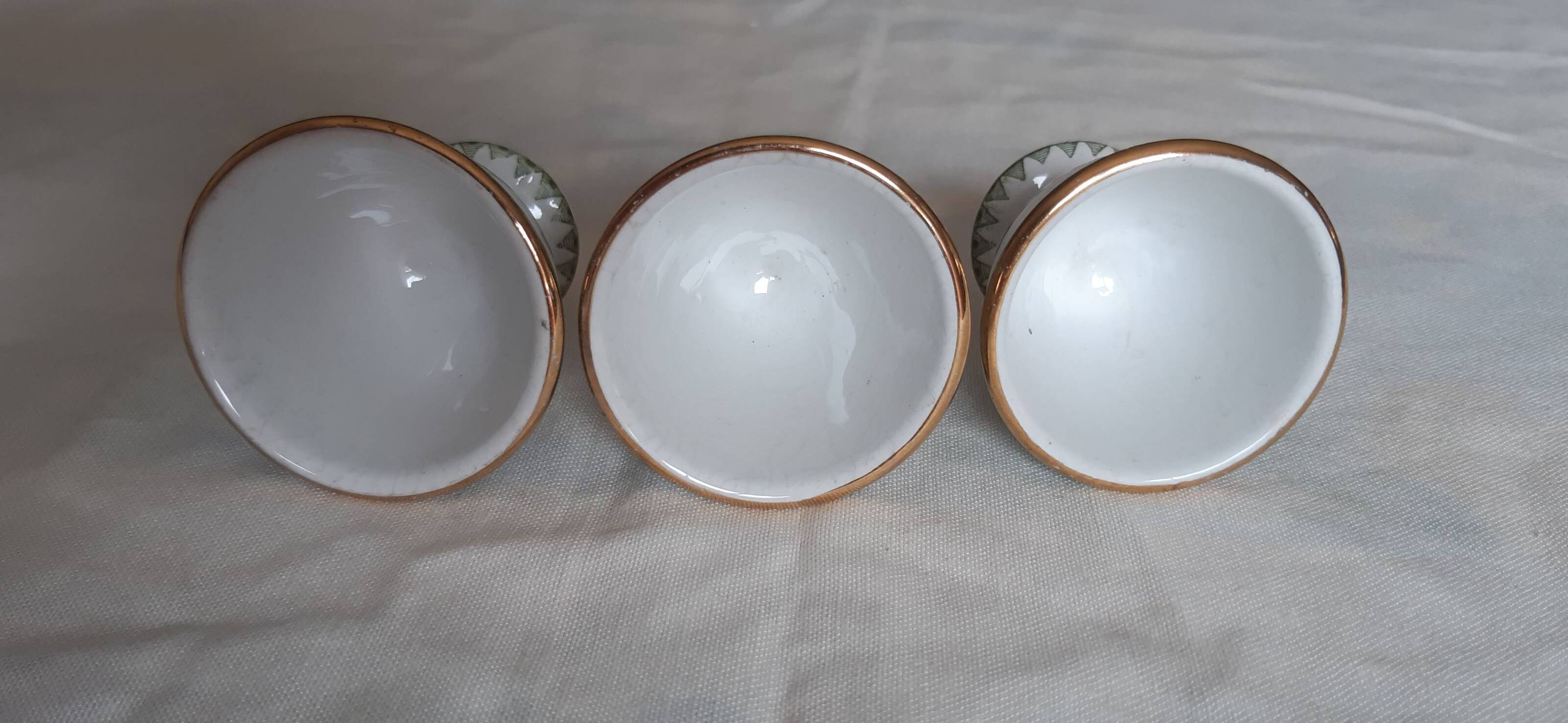 Set of three egg cups, barbel pattern decorations