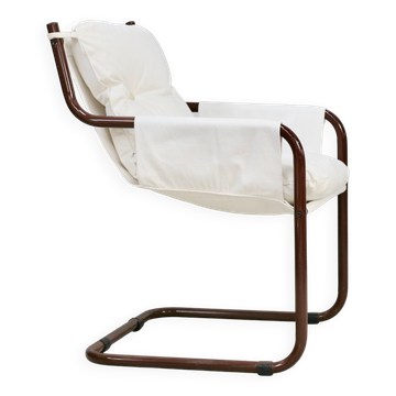 Fauteuil tubulaire, assise suspendue tissus. Circa 1970
