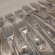 12 forks, 12 fish knives, silver-plated metal, rocaille pattern