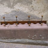 Wall coat rack has four hooks