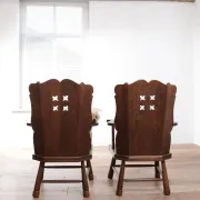 Pair of brutalist oak lounge chairs with rush seats, circa 1935