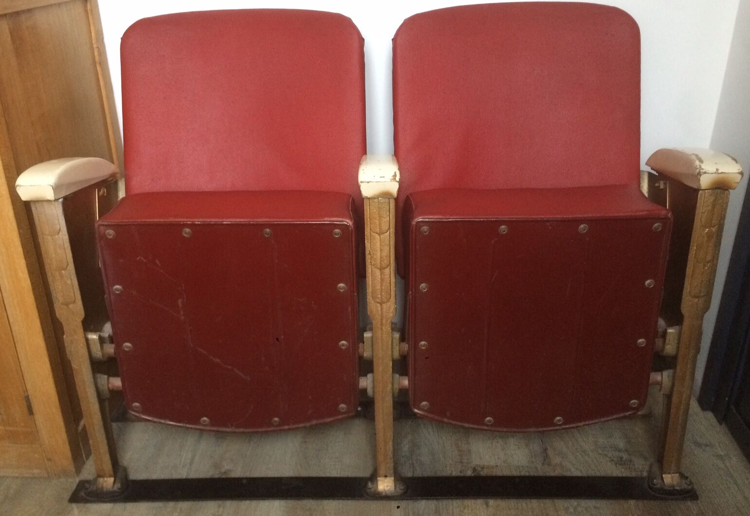 Pair of red skai leather cinema chairs