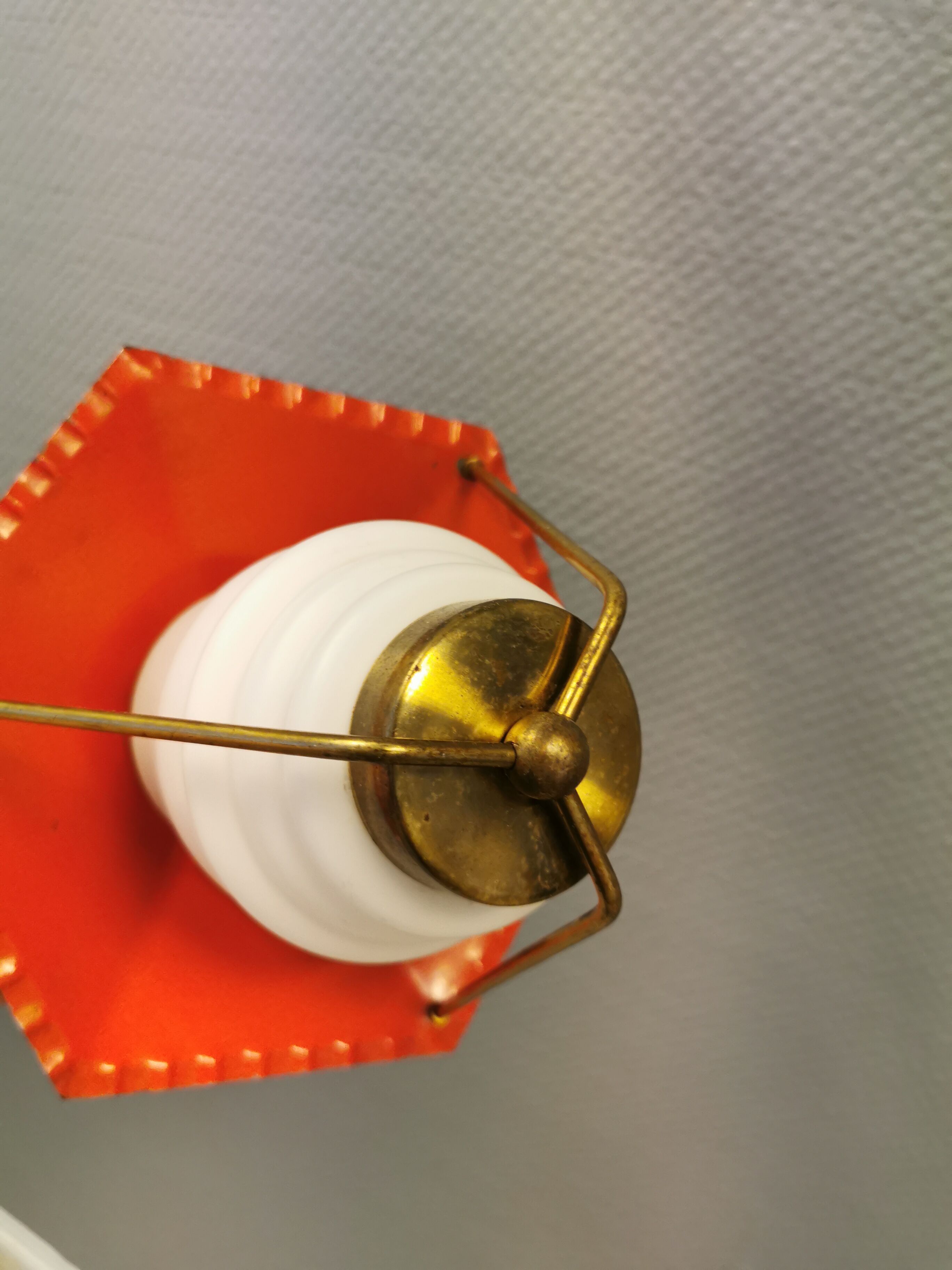 Danish hanging lamp from the 50-60s, made of brass, metal and with milky white glass shade.