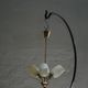 Paavo Tynell for Idman Oy, three-branch chandelier in brass and glass, mid-century, 1940s.