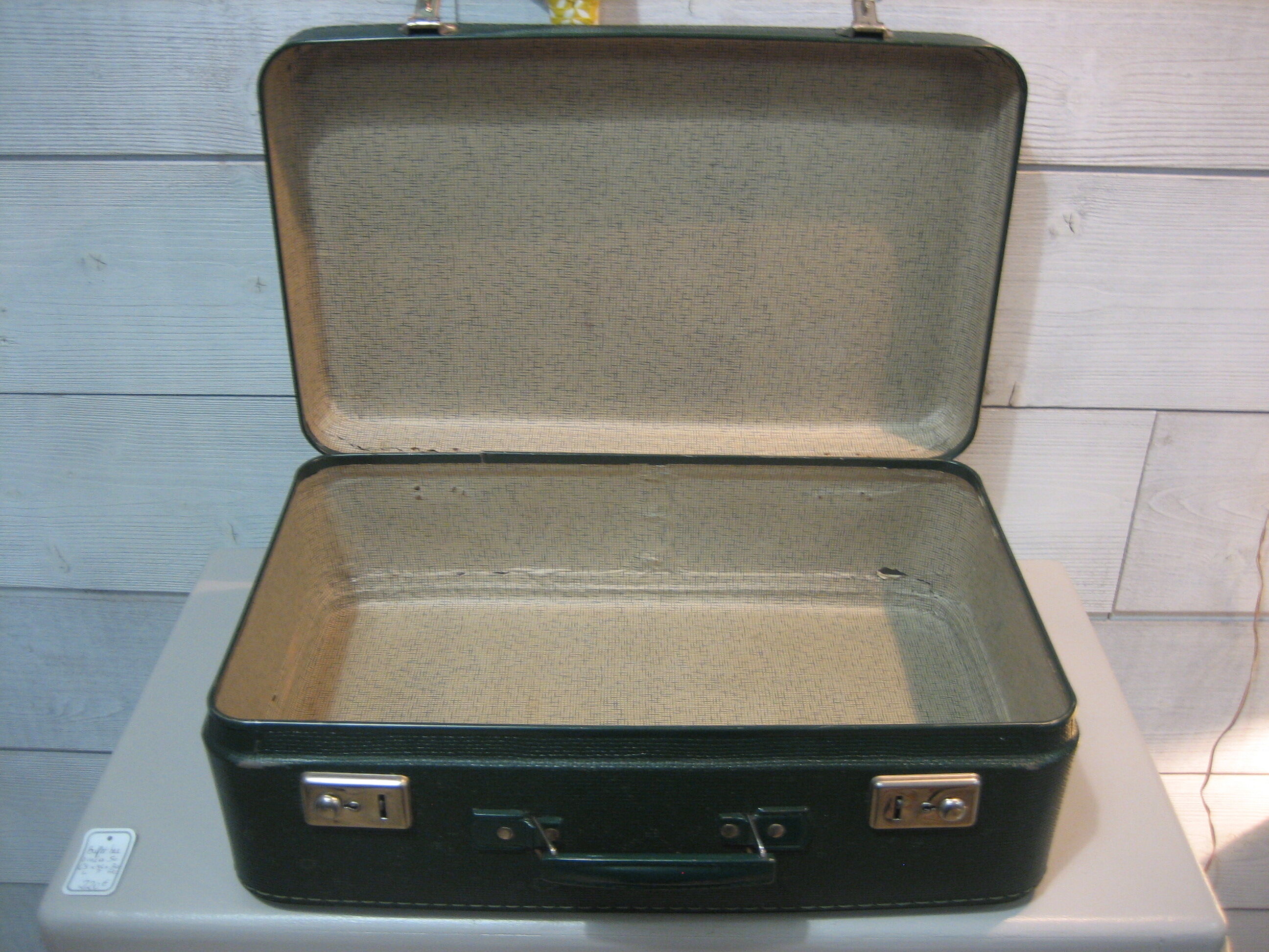 Dark green suitcase