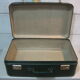 Dark green suitcase