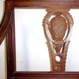 A Chair from the beginning of the 20th century in natural wood.