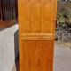 Vintage wardrobe with mirror and tapered legs.