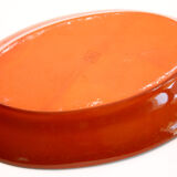 Portuguese XL dish in orange enamelled clay with unbleached flowers and green leaves