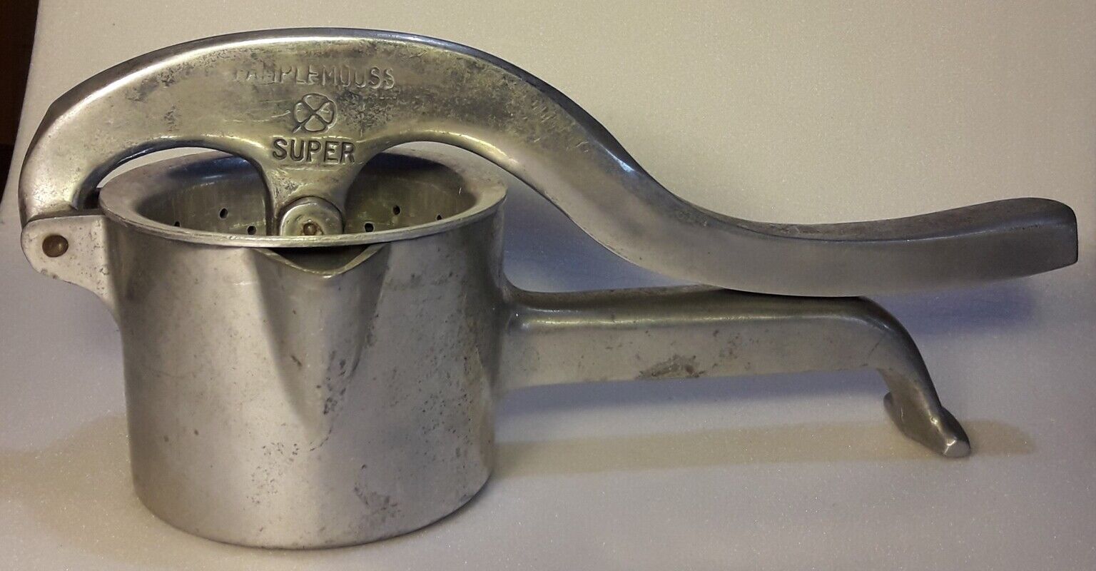 Vintage grapefruit metal citrus press