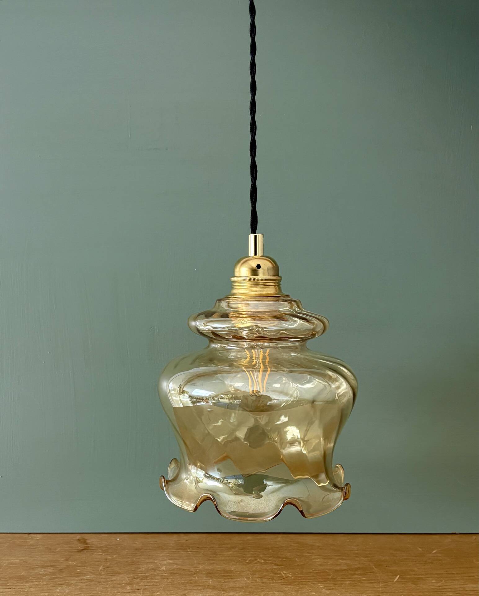 Vintage amber glass suspension globe
