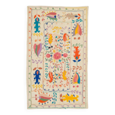 White suzani kilim rug with embroidered colorful patterns
