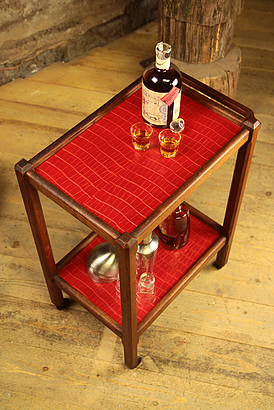 Serving in varnished chestnut and red leather