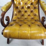 Pair of padded Chesterfield armchairs