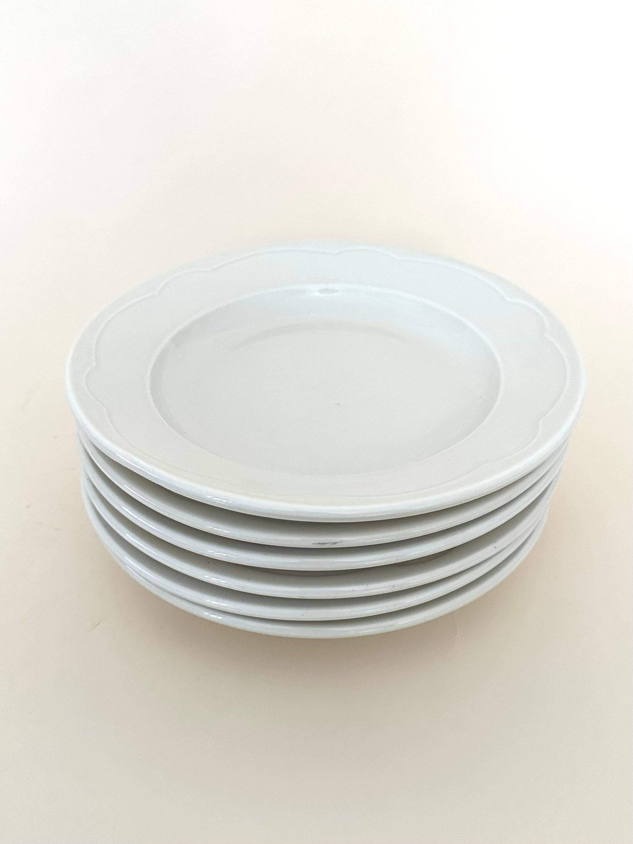 Set of six white porcelain deep plates by Pillivuyt.