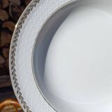 Twelve white porcelain plates