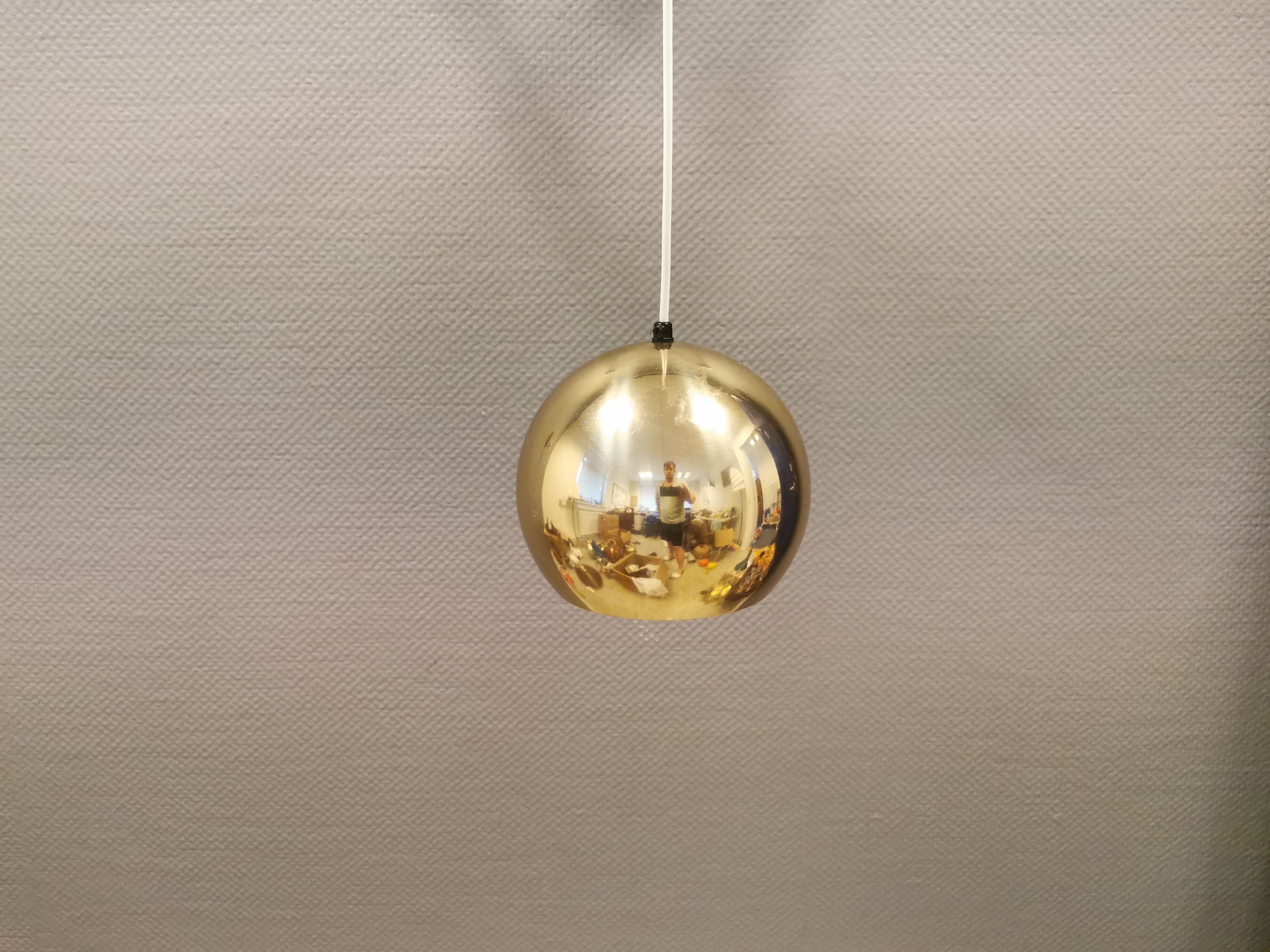 Danish ball lamp from the 80s, in gold colored lacquer.