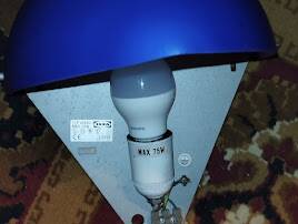 a pair of Ikea Kvintett wall lamps