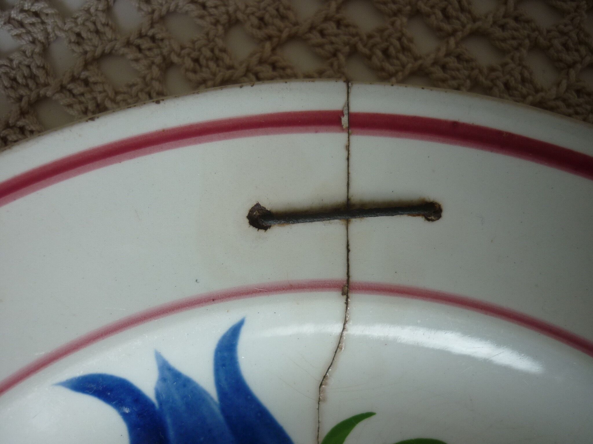 Old repaired plate stapled