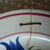 Old repaired plate stapled