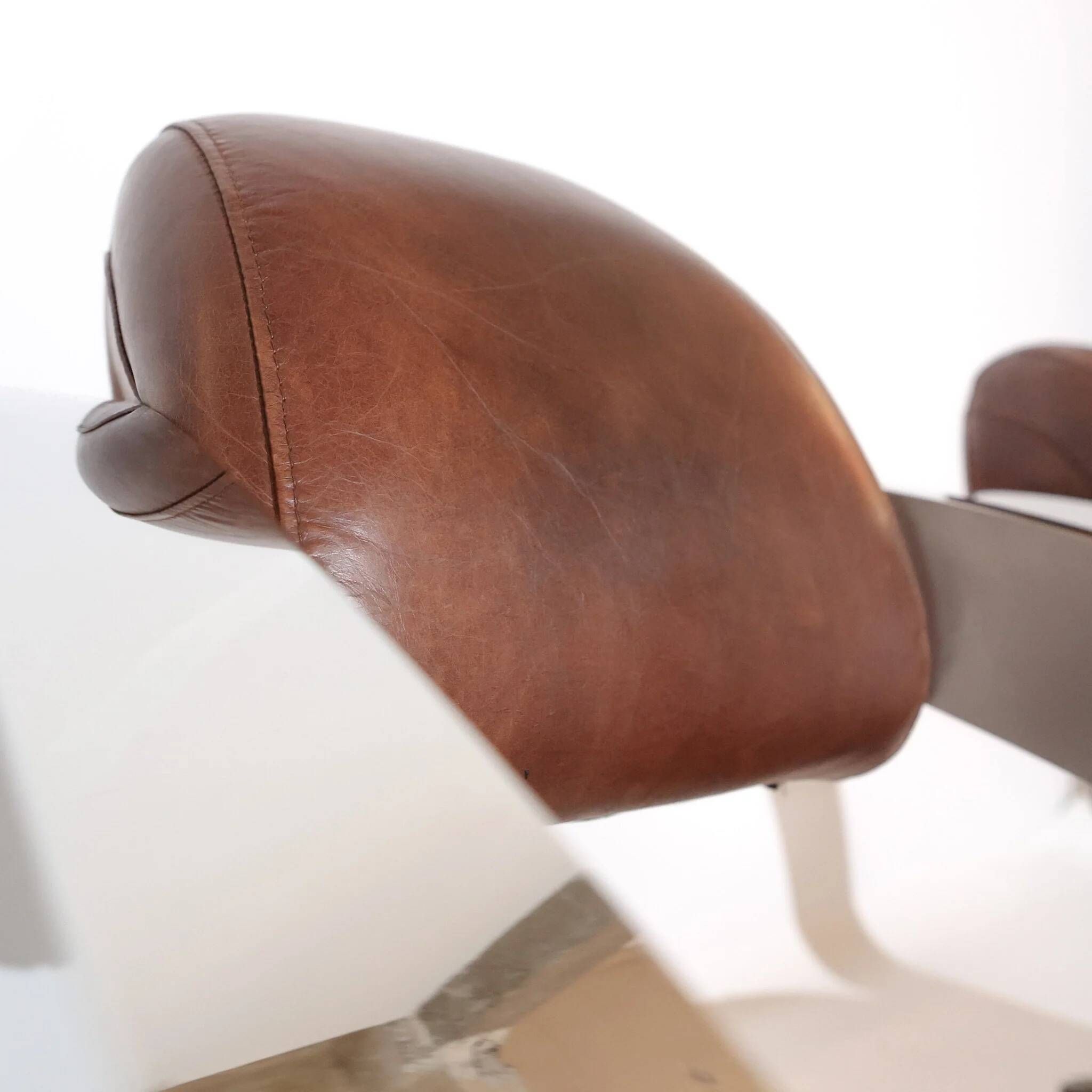 Pair of vintage lounge chairs Demon/Aviator in cognac leather and polished steel, Art Deco style.