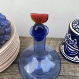 Blue glass decanter with watermelon cap