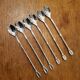 6 long silver-plated metal spoons