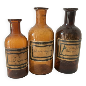 3 amber apothecary bottles