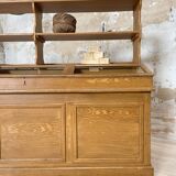 Wooden hardware cabinet painted with wood effect, circa 1940.