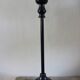 Table lamp with a patinated base and vintage woven shade.