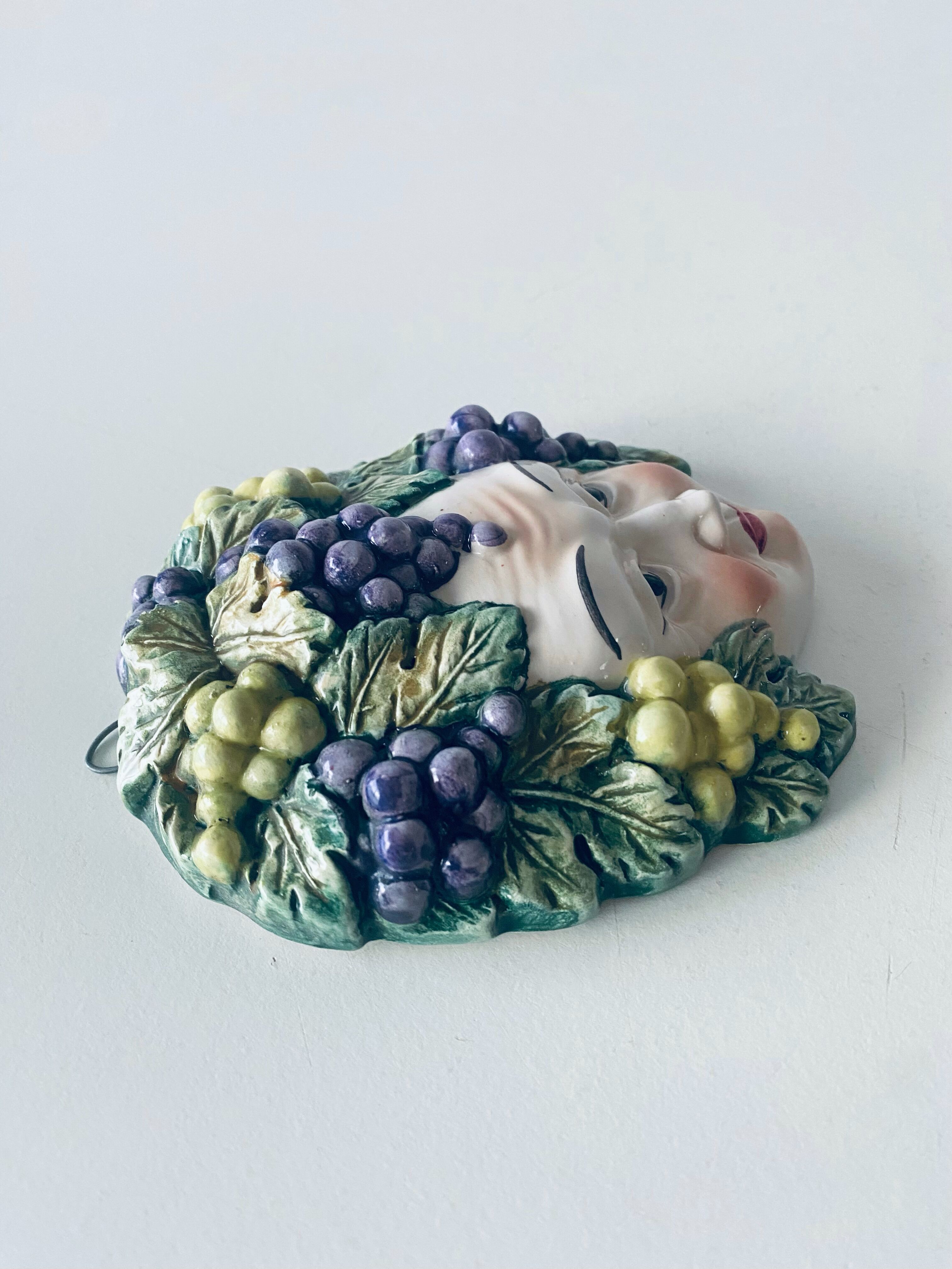 Ceramic wall face signed Il Falco