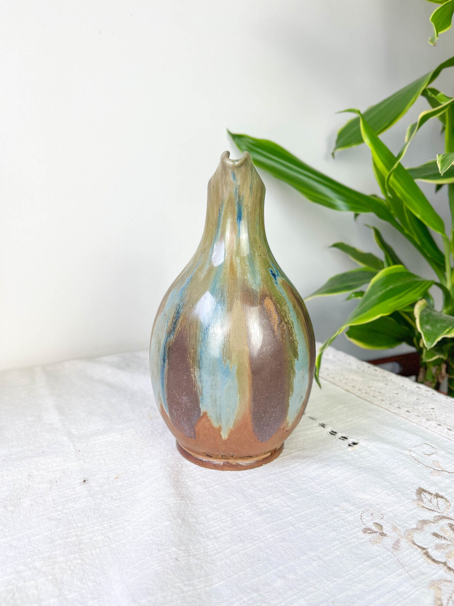 Art Nouveau style carafe in flamed stoneware with blue and brown drips