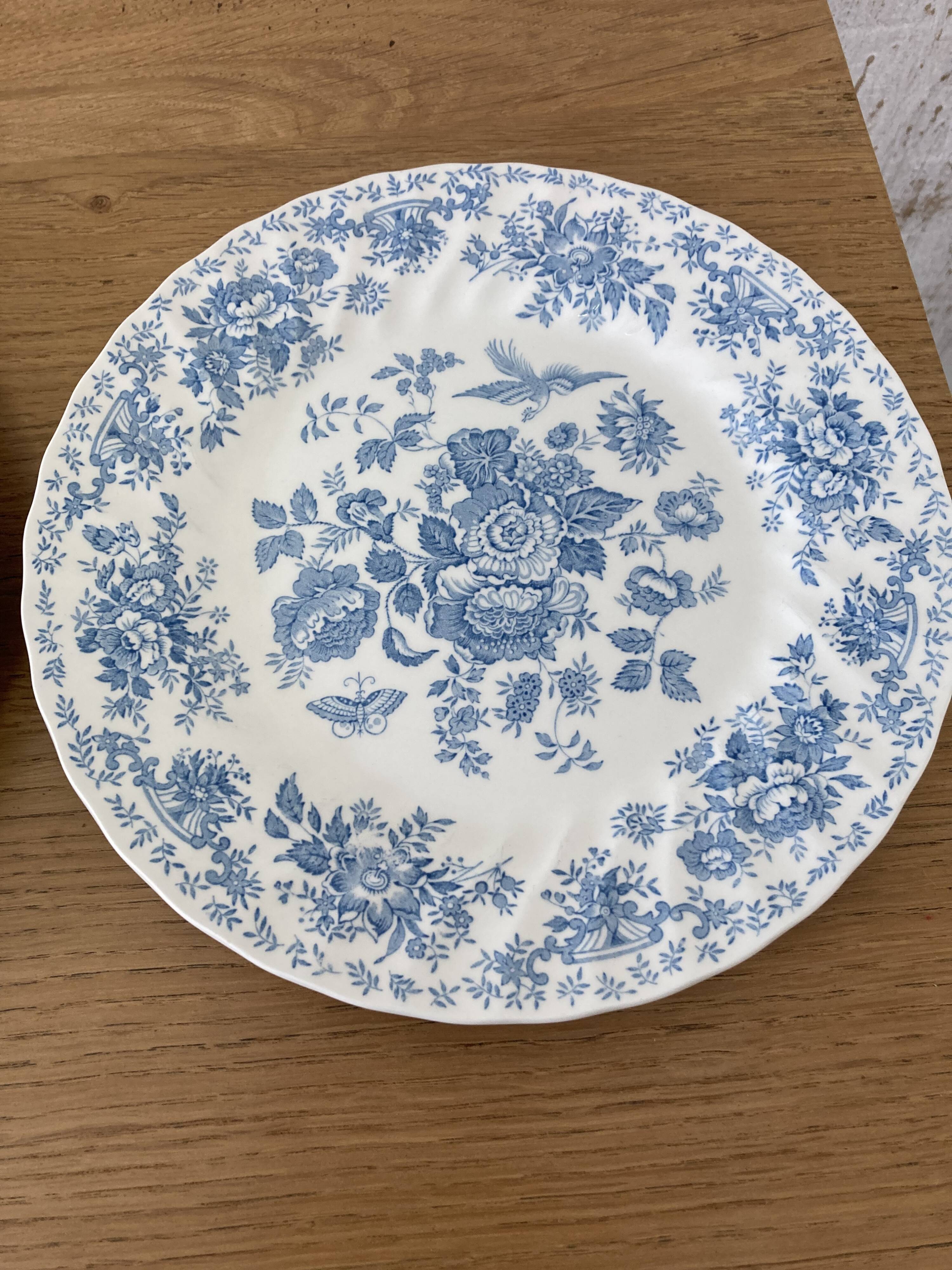 Four old blue plates