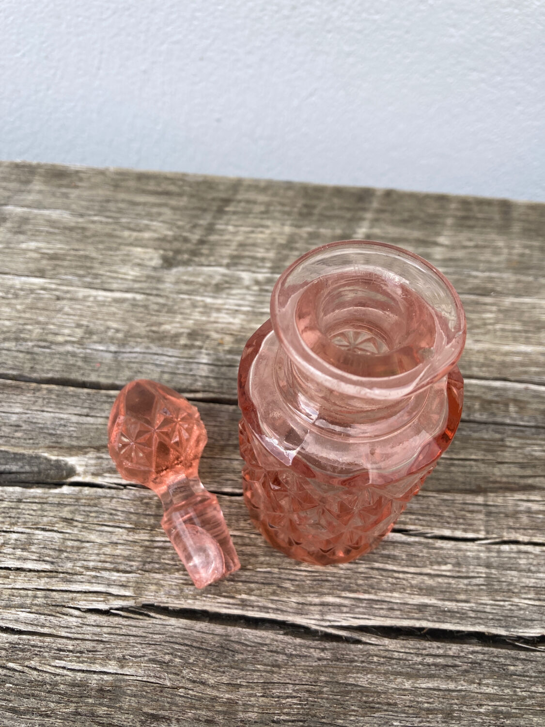 Art Deco perfume bottle in old amber pink glass