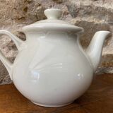 Small light beige earthenware teapot