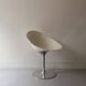 Ero swivel armchair in metal and white shell, p. starck design for kartell
