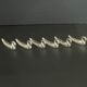 Set of 6 silver metal knife holders for table