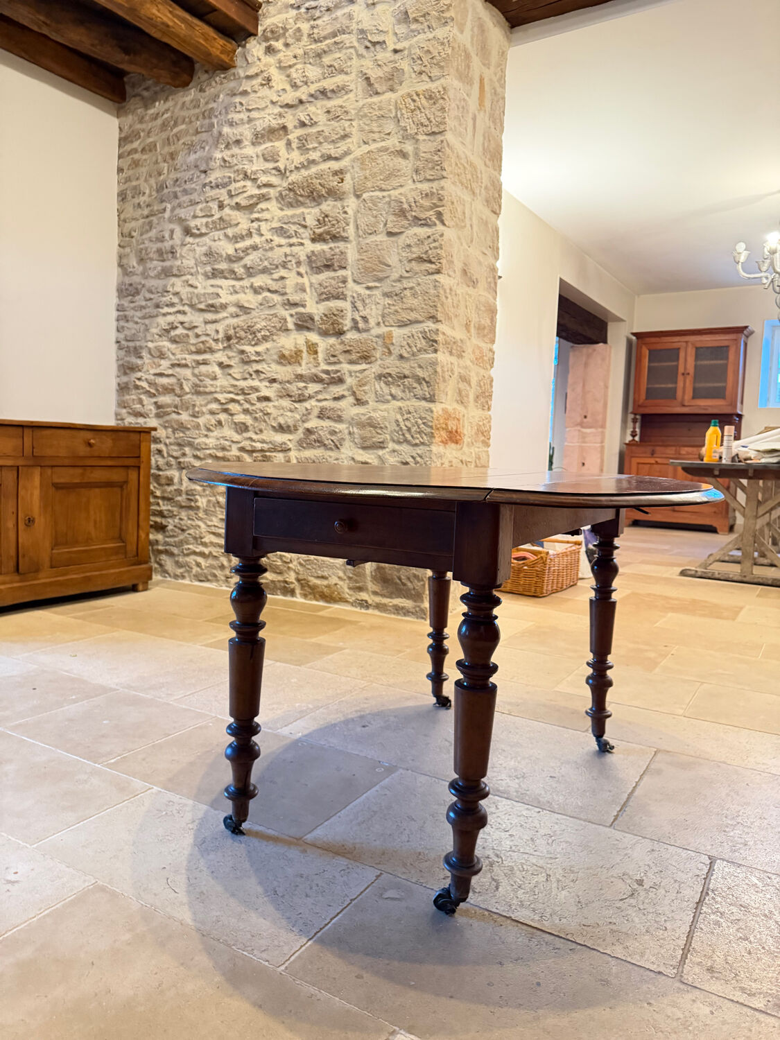 Oval drop-leaf table